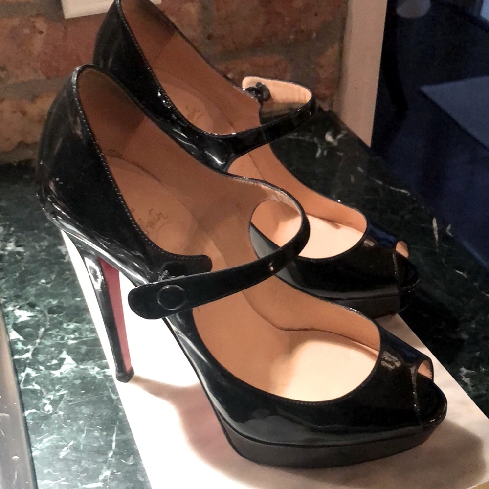 Christian Louboutin black patent leather Mary Janes.